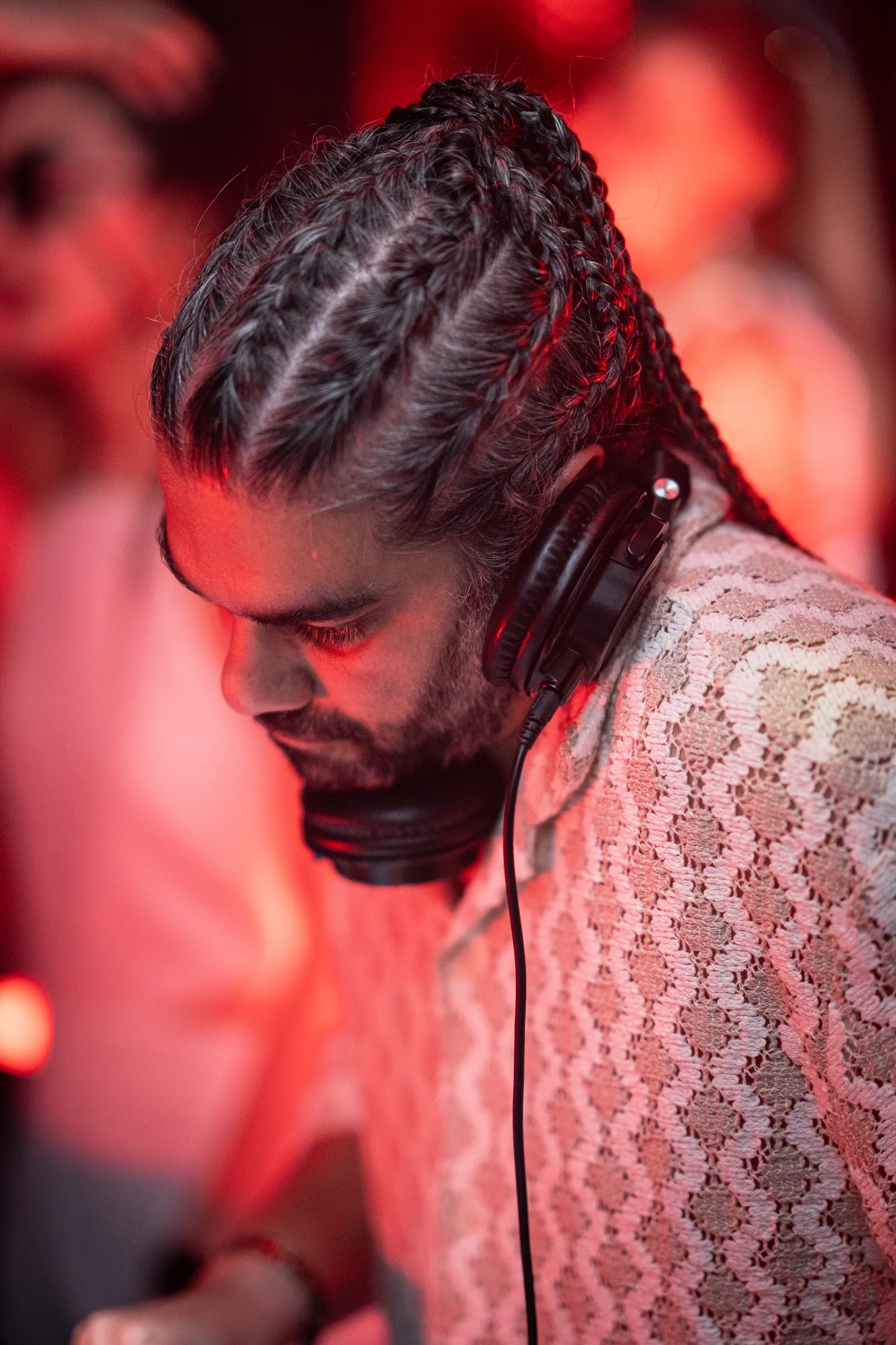 DJ Mahbod at the decks in red light