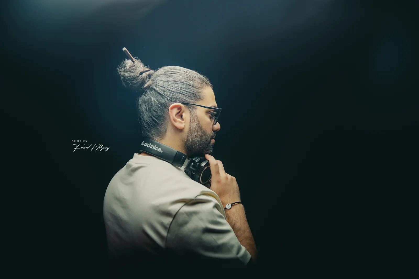 DJ Mahbod in a blue studio light
